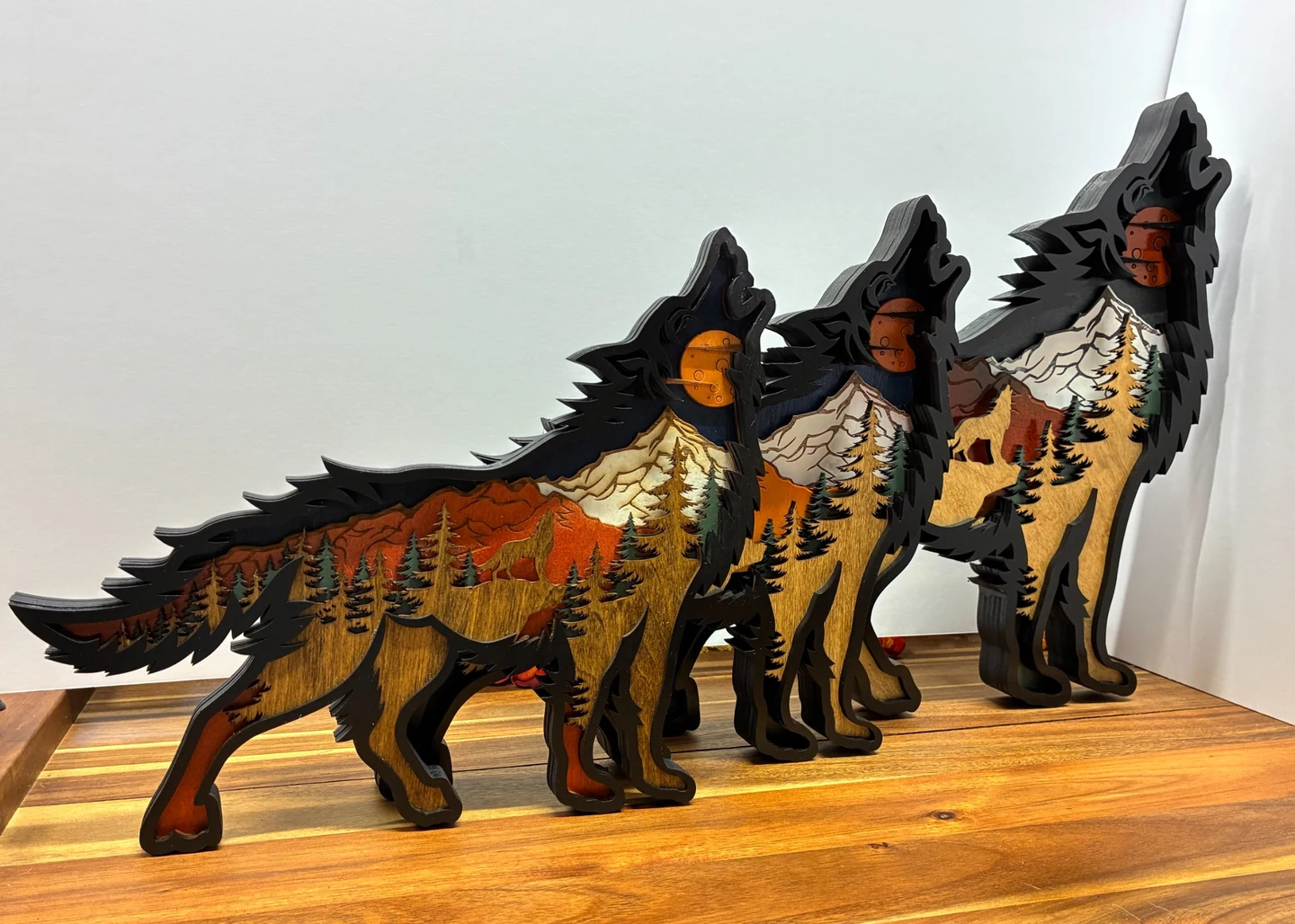 Large, medium, and small six-layered freestanding wolf scenes
